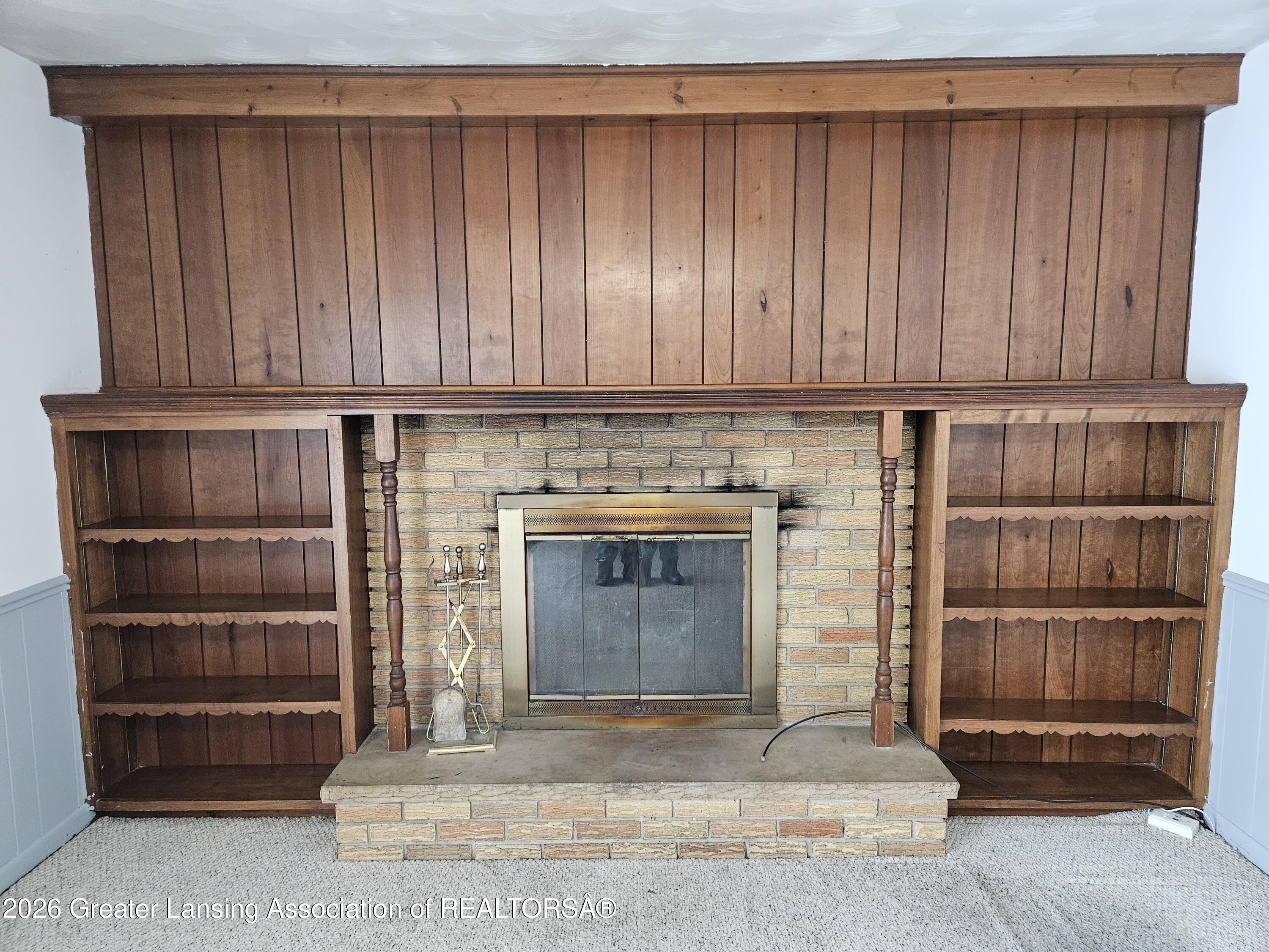 2800 Tecumseh River Road Lansing, MI 48906 - Photo 6 of 27 Den w Fireplace
