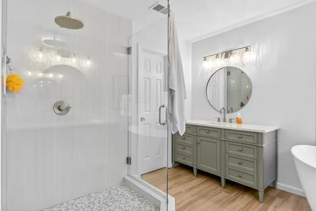 a bathroom with a mirror a sink and a mirror