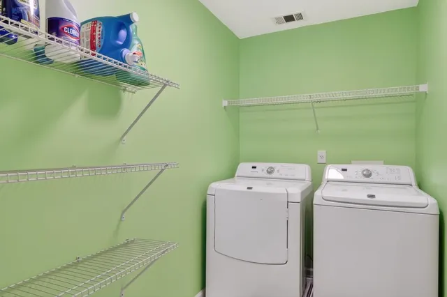 a view of a livingroom with furniture and windows