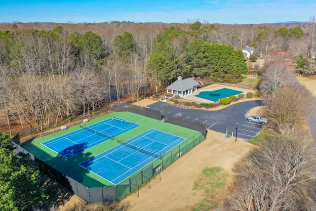 a view of a backyard with sitting area
