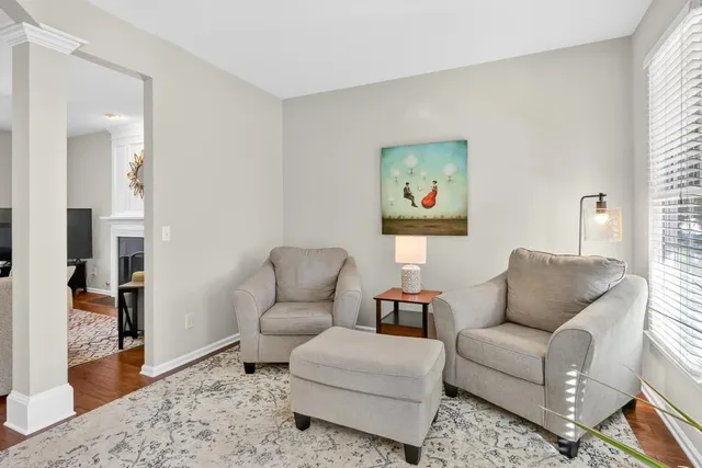 a living room with furniture and a rug