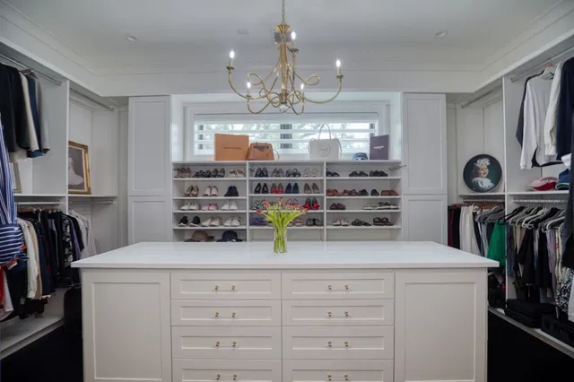 a kitchen with refrigerator and cabinets