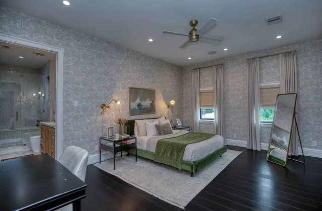 a bedroom with a bed and a view of kitchen