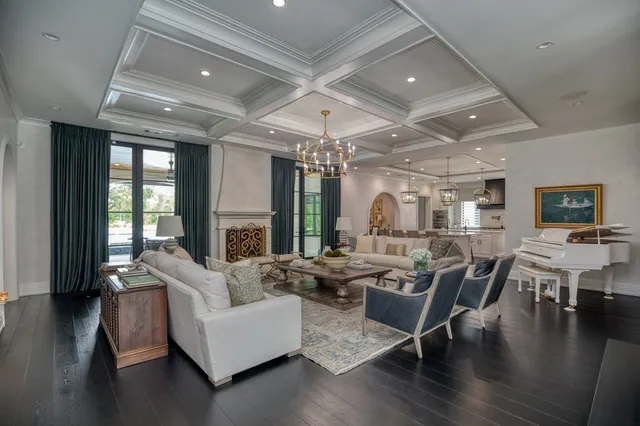 a living room with lots of furniture and wooden floor