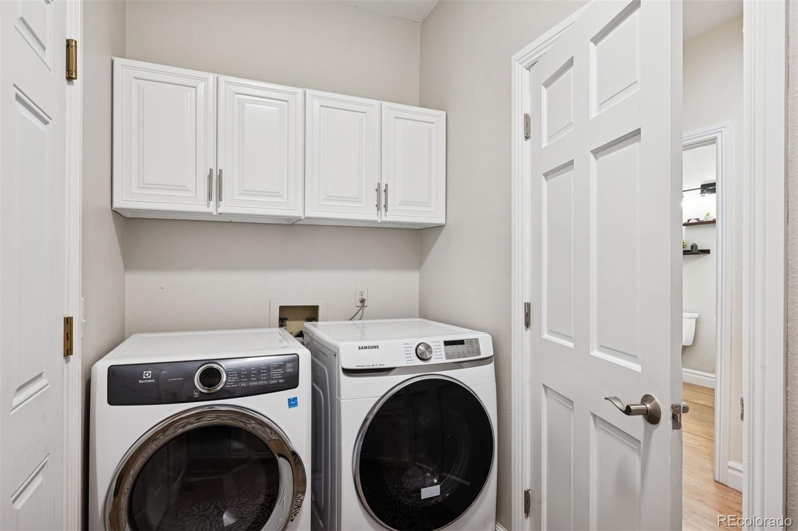 2187 Wynterbrook Drive Highlands Ranch, CO 80126 - Photo 19 of 41 a view of storage and utility room with washer and dryer