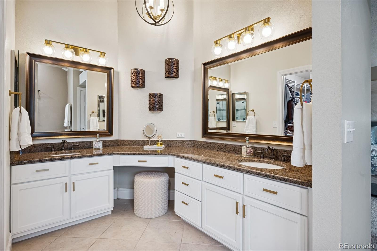 2187 Wynterbrook Drive Highlands Ranch, CO 80126 - Photo 23 of 41 a bathroom with a granite countertop sink and a mirror