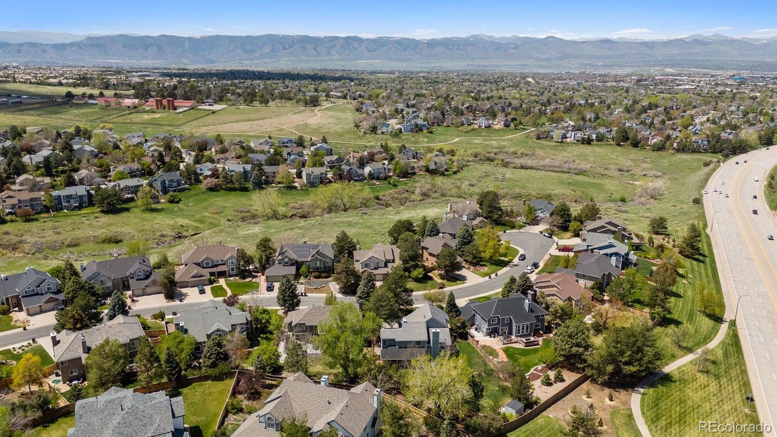 2187 Wynterbrook Drive Highlands Ranch, CO 80126 - Photo 38 of 41 a view of a city with mountains in the background