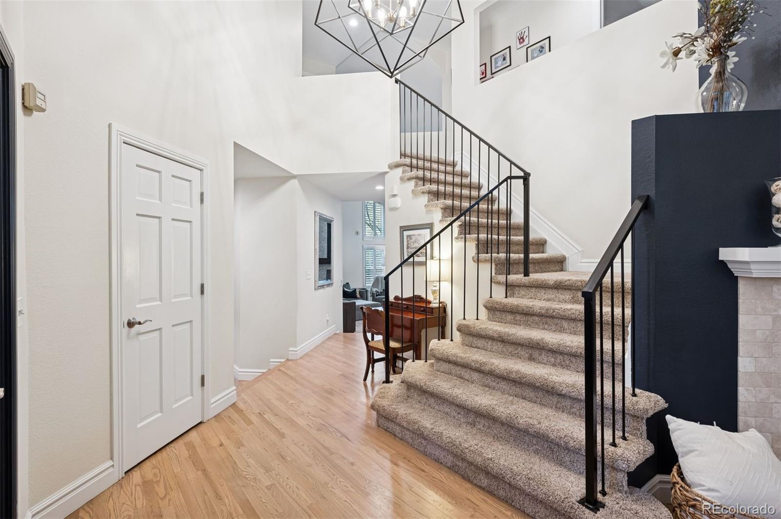 2187 Wynterbrook Drive Highlands Ranch, CO 80126 - Photo 10 of 41 a view of entryway and hall with wooden floor