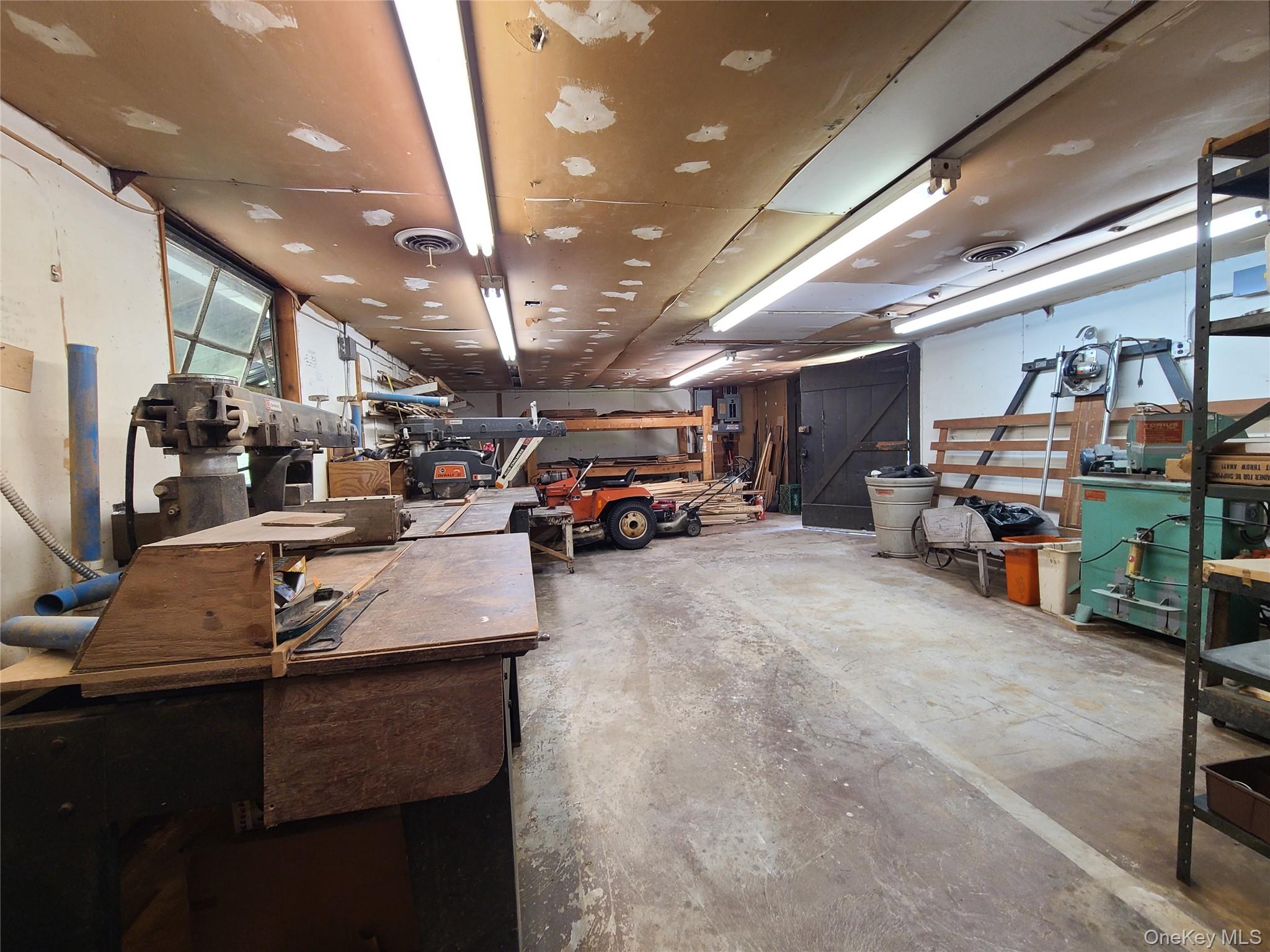153 Shore Road Swan Lake, NY 12783 - Photo 16 of 39 a car garage with parked cars