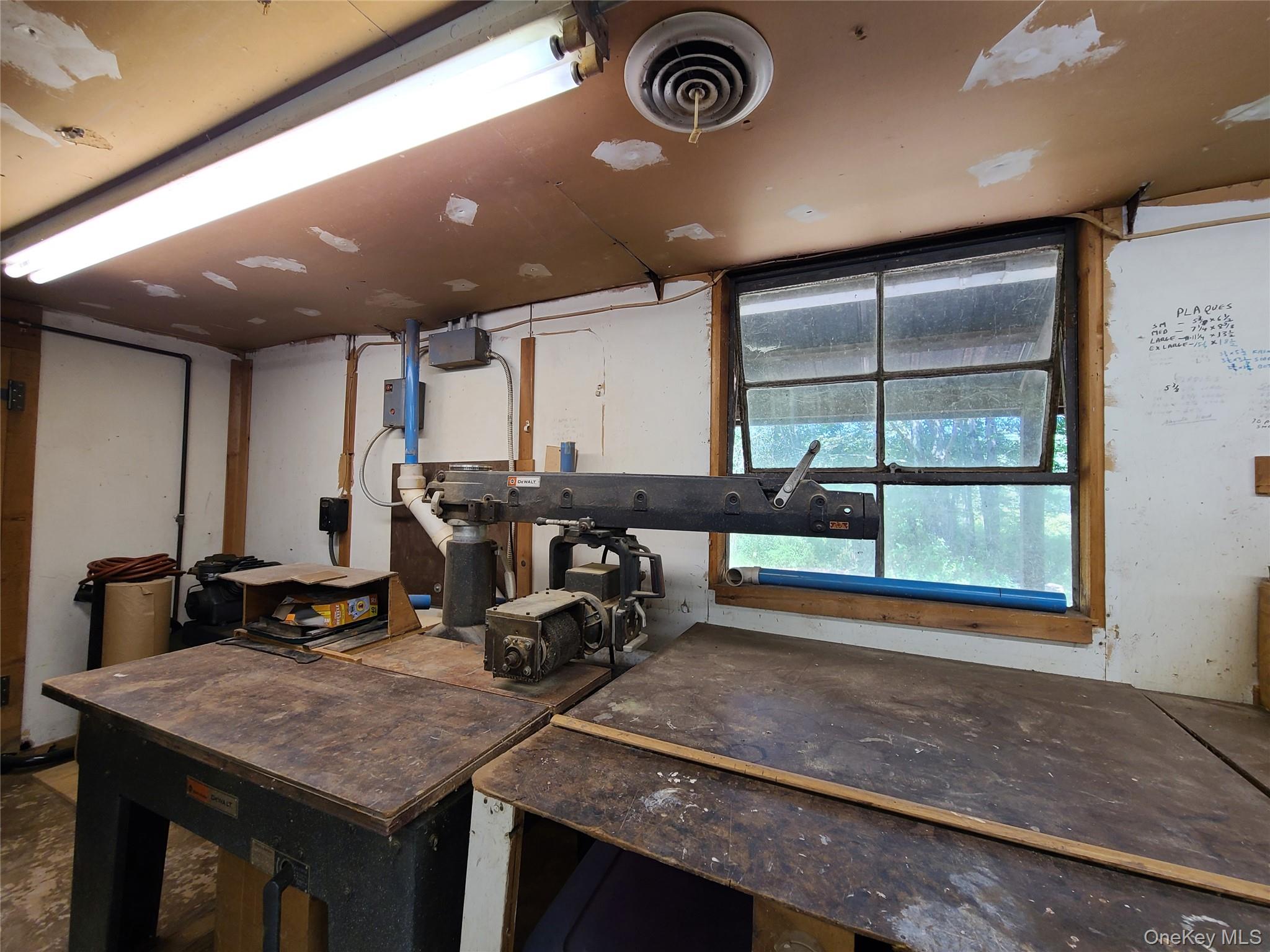 153 Shore Road Swan Lake, NY 12783 - Photo 28 of 39 a room with gym equipment and a large window
