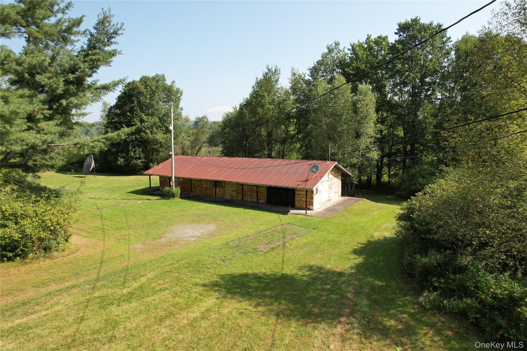 153 Shore Road Swan Lake, NY 12783 - Photo 39 of 39 a yard with a house and garden