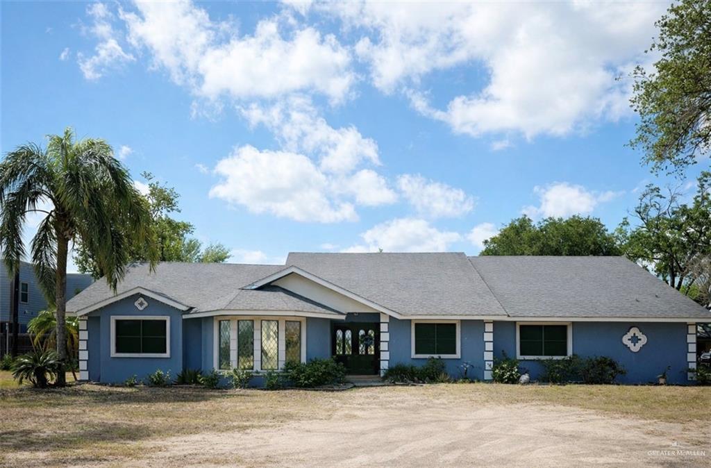 400 South 22nd Street Hidalgo, TX 78557 - Photo 1 of 1 a front view of a house with a garden
