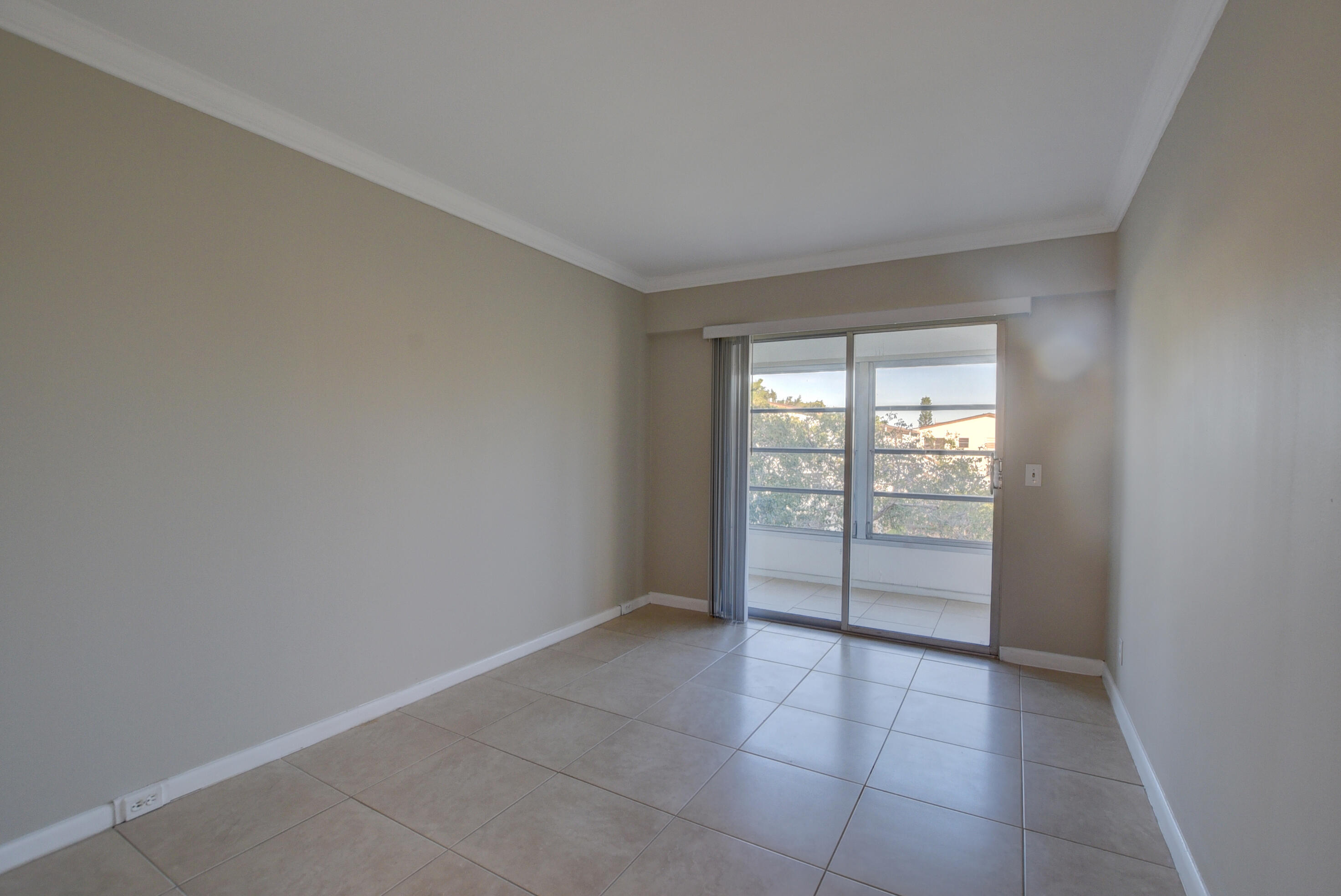 294 Mansfield G Boca Raton, FL 33434 - Photo 9 of 21 wooden floor in an empty room with a window