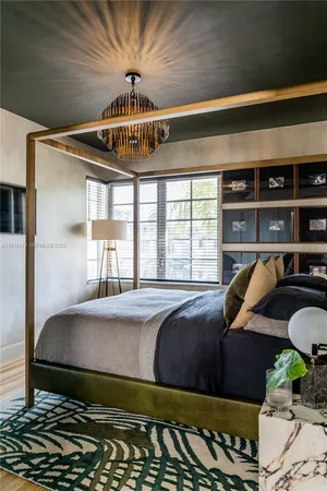 a bedroom with bed and window