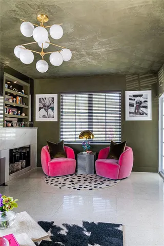 a view of lobby with furniture and a fireplace