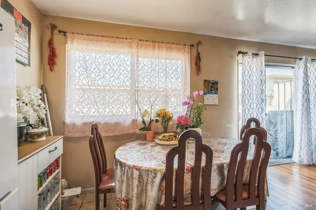 a view of a dining room with furniture window and wooden floor