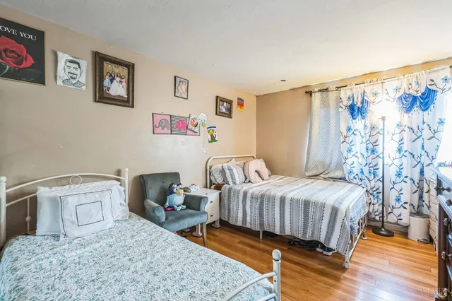 a bedroom with a bed and a table in it