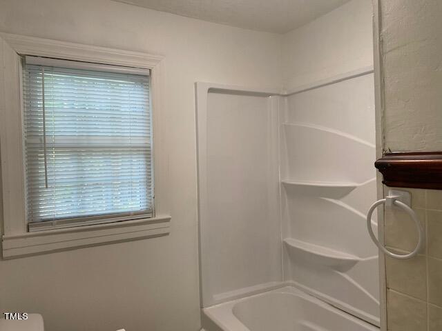 9081 Virgilina Road Roxboro, NC 27574 - Photo 26 of 36 bathroom window with tub/shower