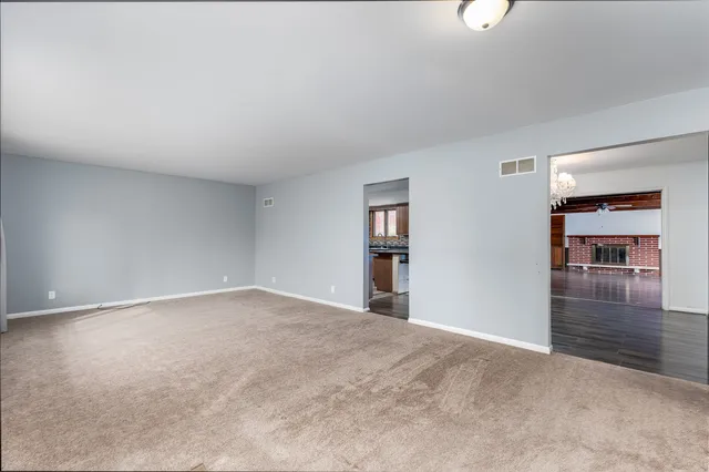 a bedroom with a bed couch and a window