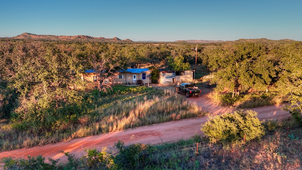 18248 Bode Peak Road Pontotoc, TX 76869 - Photo 9 of 17 a view of a lake with mountains in the background