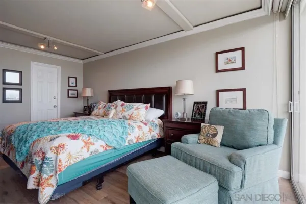 a bedroom with a bed and couch