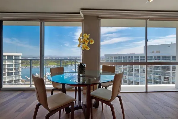 a view of a dining room with furniture window and wooden floor