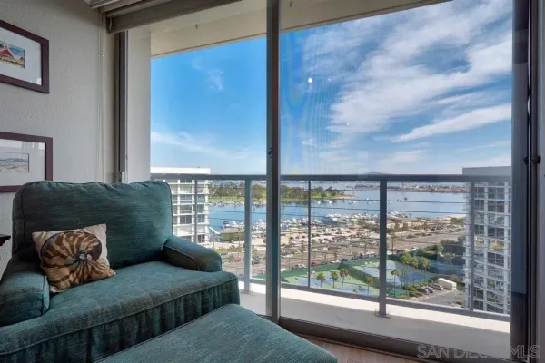 a living room with a large window and a couch