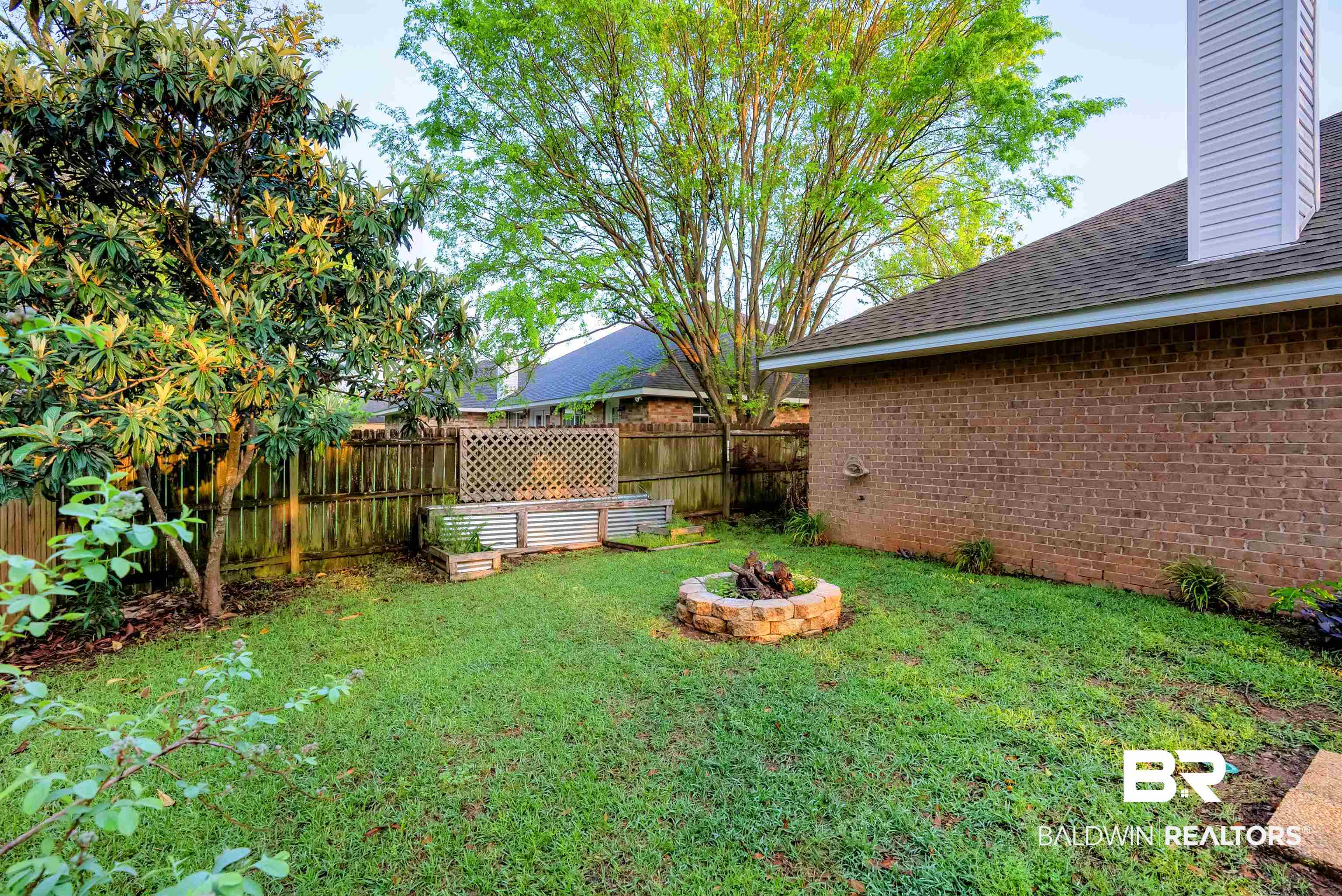 165 Pemberton Loop Fairhope, AL 36532 - Photo 23 of 25 View of yard featuring an outdoor fire pit and fence