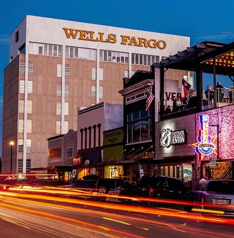 a view of street with shops and retail shops