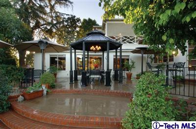 Undisclosed Address Glendale, CA 91202 - Photo 13 of 18 a view of a house with backyard and sitting area