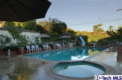 Undisclosed Address Glendale, CA 91202 - Photo 14 of 18 a view of a swimming pool with a patio
