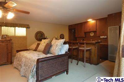 Undisclosed Address Glendale, CA 91202 - Photo 17 of 18 a bed room with a bed and a night stand