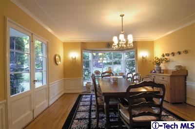 Undisclosed Address Glendale, CA 91202 - Photo 4 of 18 a view of a dining room with furniture a chandelier and large windows