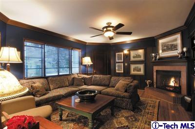 Undisclosed Address Glendale, CA 91202 - Photo 5 of 18 a living room with furniture a fireplace and a large window