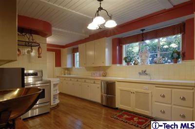 Undisclosed Address Glendale, CA 91202 - Photo 6 of 18 a kitchen with sink stove and cabinets