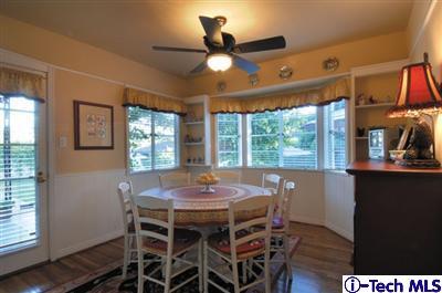 Undisclosed Address Glendale, CA 91202 - Photo 7 of 18 a dining room with furniture a chandelier and wooden floor