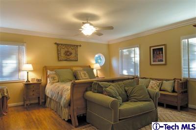 Undisclosed Address Glendale, CA 91202 - Photo 10 of 18 a bed room with a bed and a couch