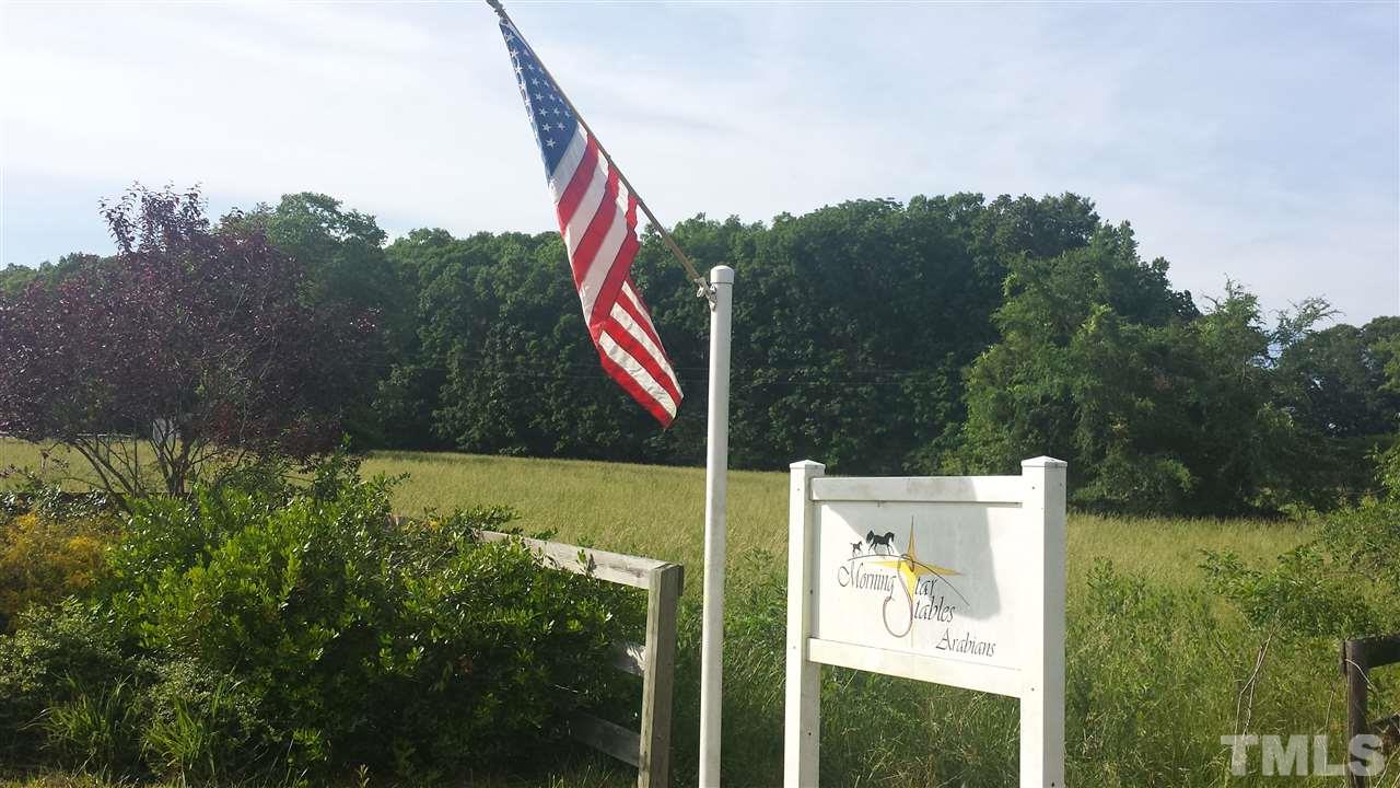 9611 Rougemont Road Bahama, NC 27503 - Photo 2 of 25 a view of a park with welcome board