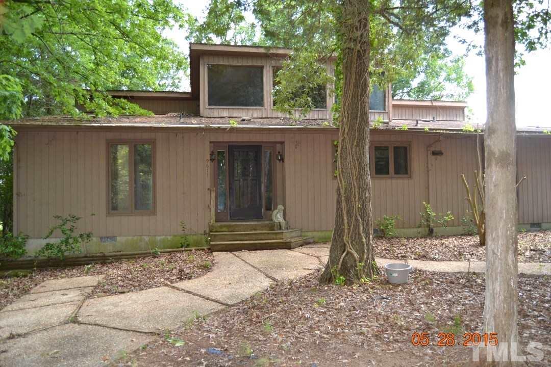 9611 Rougemont Road Bahama, NC 27503 - Photo 11 of 25 a front view of a house with garden
