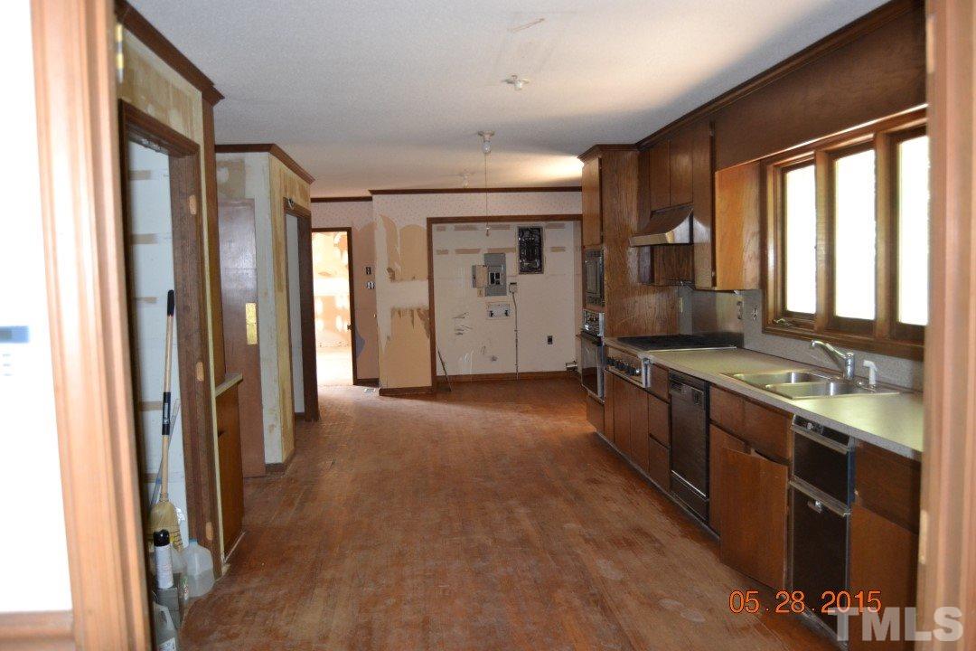9611 Rougemont Road Bahama, NC 27503 - Photo 17 of 25 a view of a large kitchen with windows