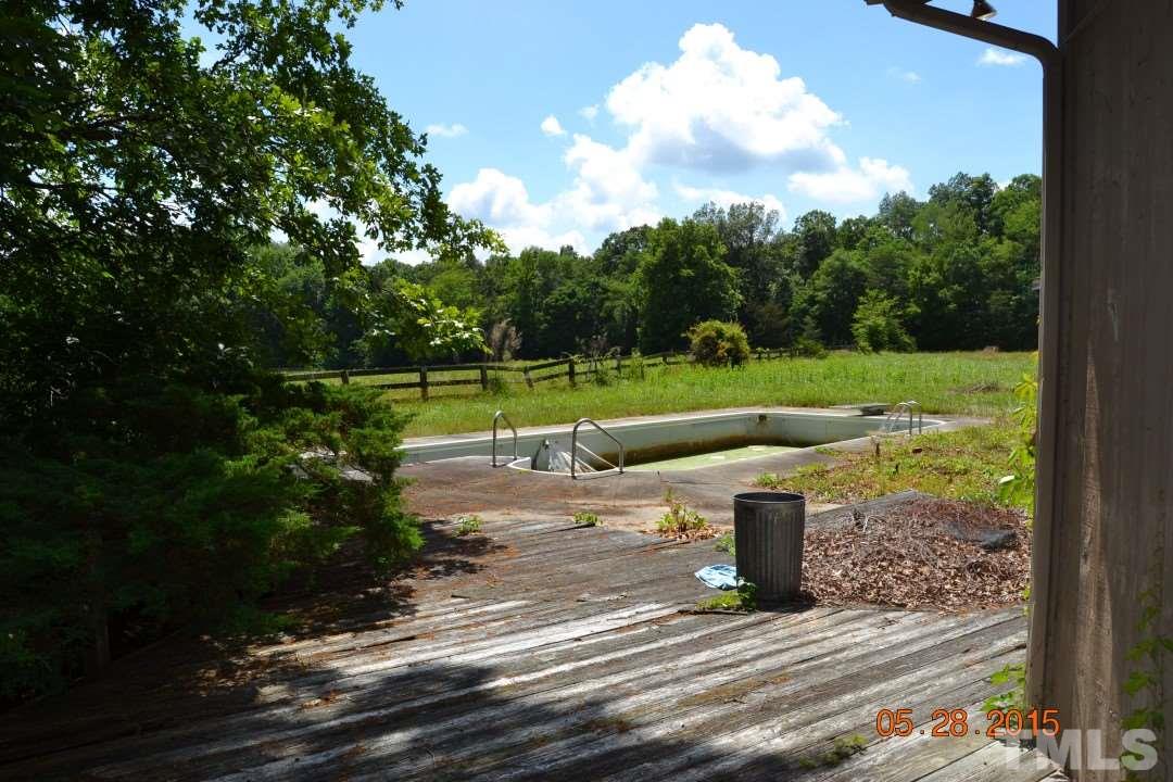 9611 Rougemont Road Bahama, NC 27503 - Photo 22 of 25 a view of a park with large trees