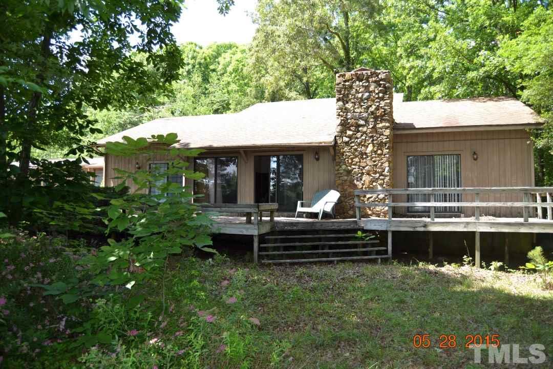 9611 Rougemont Road Bahama, NC 27503 - Photo 23 of 25 a view of a house and a yard and sitting area