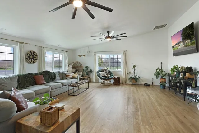 a bedroom with furniture and a window