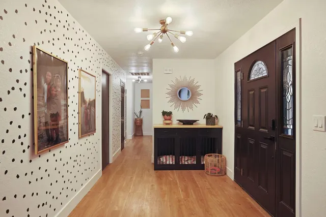a view of a livingroom with furniture and workspace