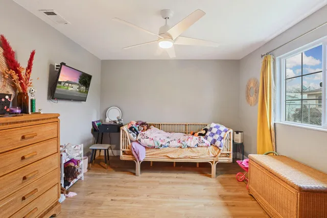 a bed room with a bed and a chandelier