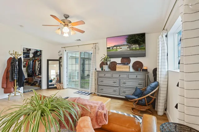 a view of swimming pool with outdoor seating and plants