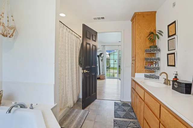 a view of a house with a backyard and porch