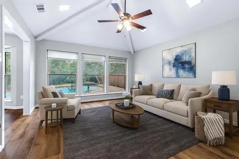 a living room with furniture and a large window