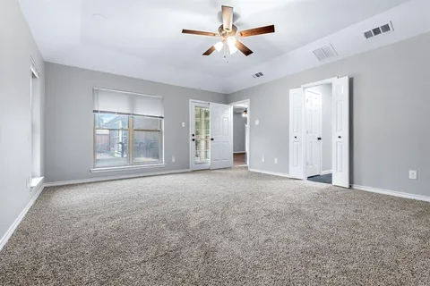 a view of empty room with fan