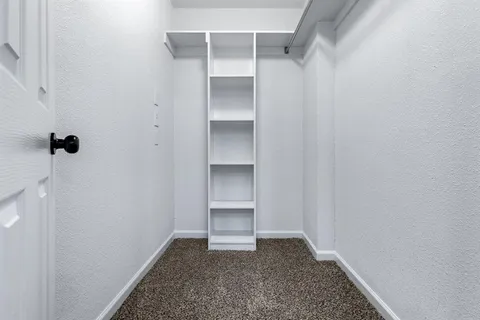 a view of an empty walk in closet